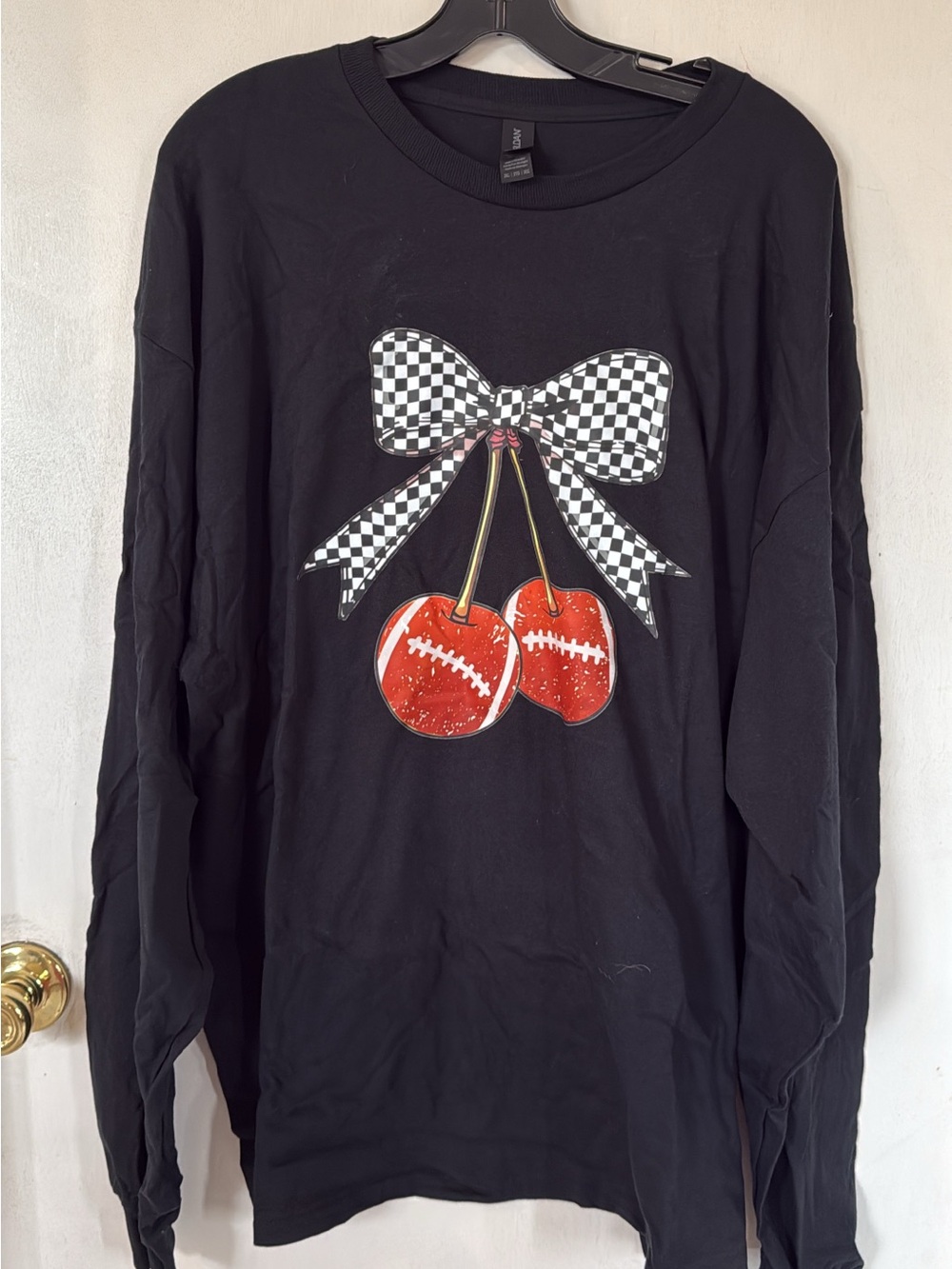 Black Long-Sleeve Graphic Top with Checkerboard Bow & Red Cherries